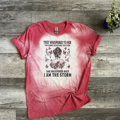 They whispered to her you cannot withstand the storm. She whispered back I am the storm red bleached tee