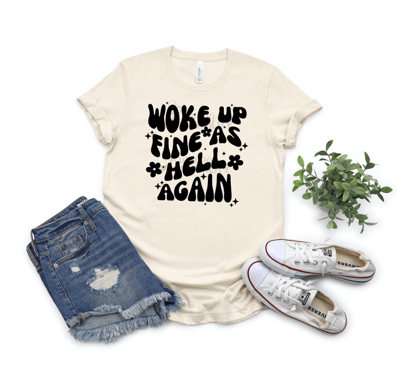 Woke up fine as hell again printed on the front of the shirt on heather natural color tee